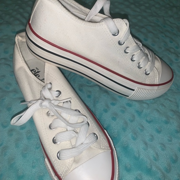 white sneakers with black stripes